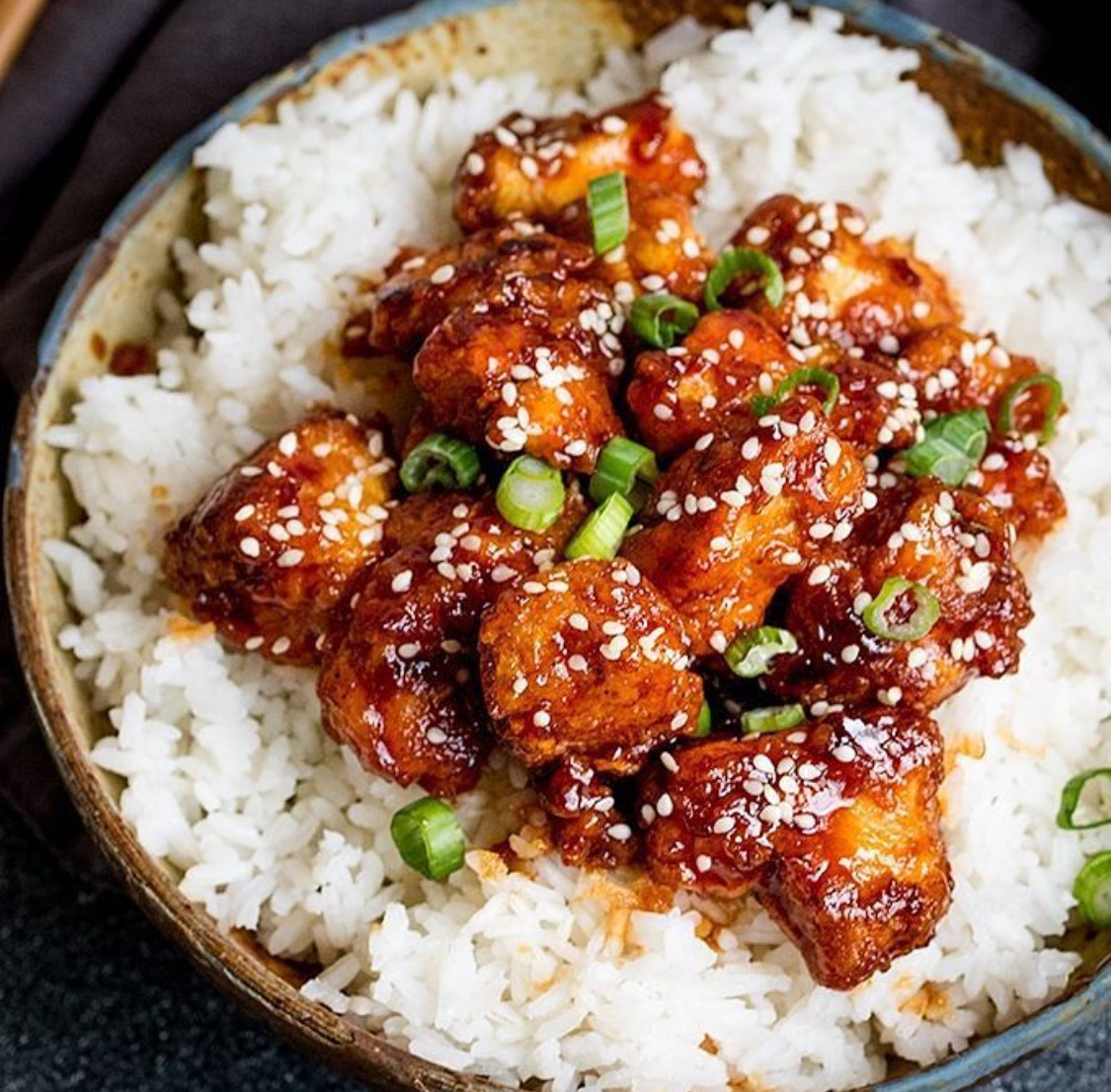 Crispy sesame chicken in sticky Asian sauce is a favourite at home too 